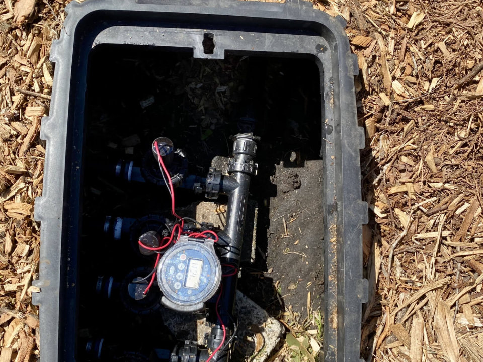 Irrigation system controller and valves in an open sprinkler box